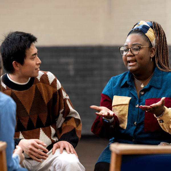 Woman speaking at a community forum